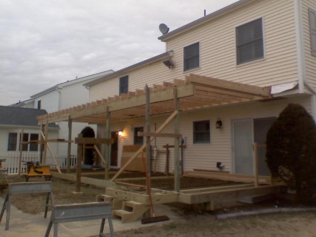 Before a completed custom deck builder project in the Ocean City, NJ area